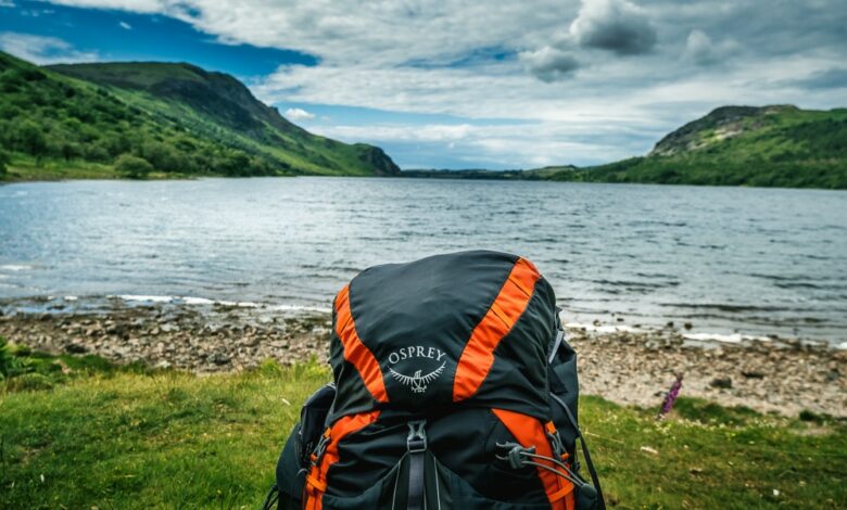 A backpack in front of a lake on the Coast to Coast