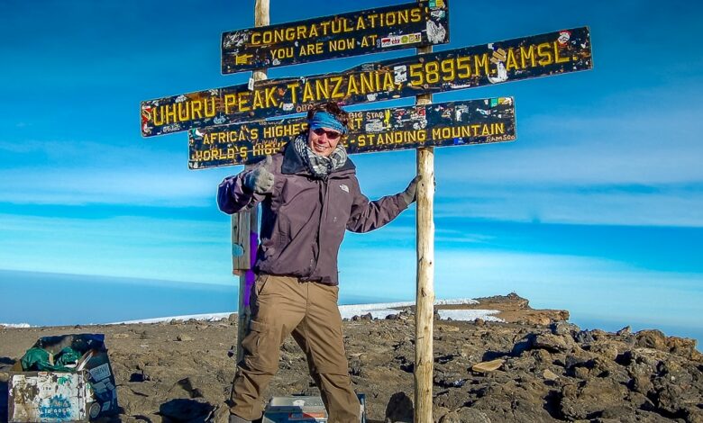 Peter on the summit of Mount Kilimanjaro in Tanzania